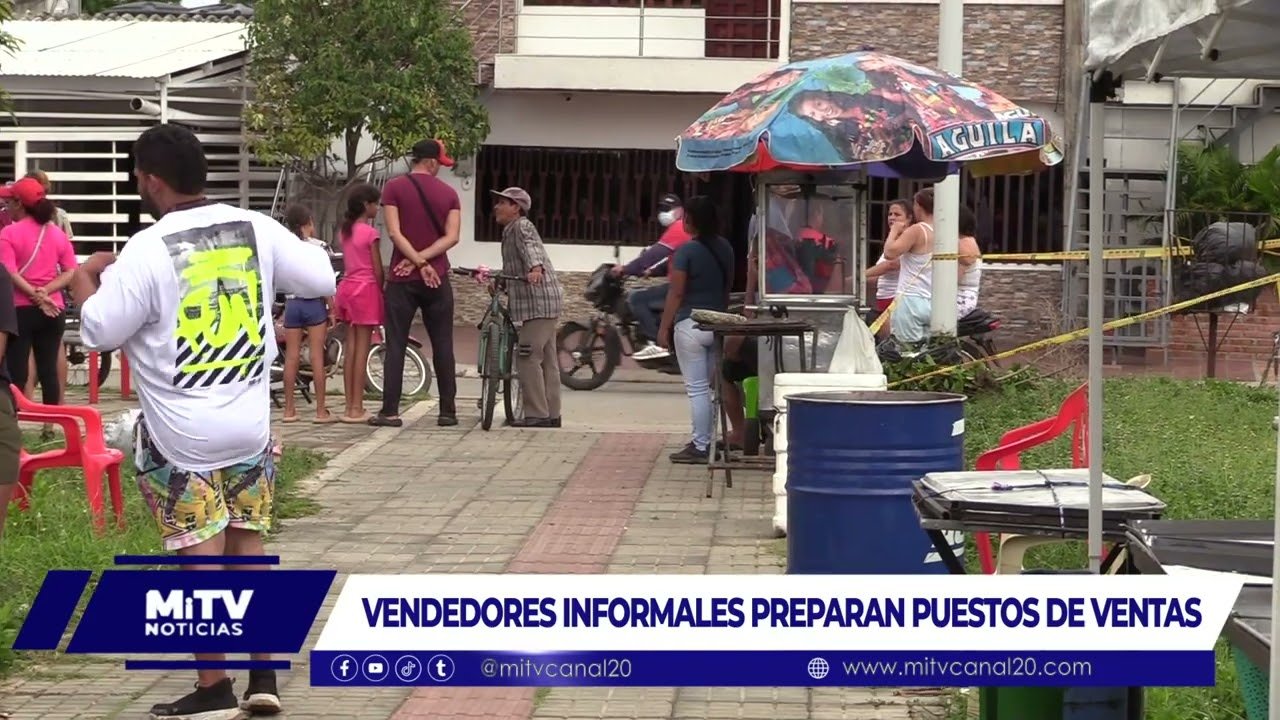 VENDEDORES PREPARAN PUESTO DE VENTAS